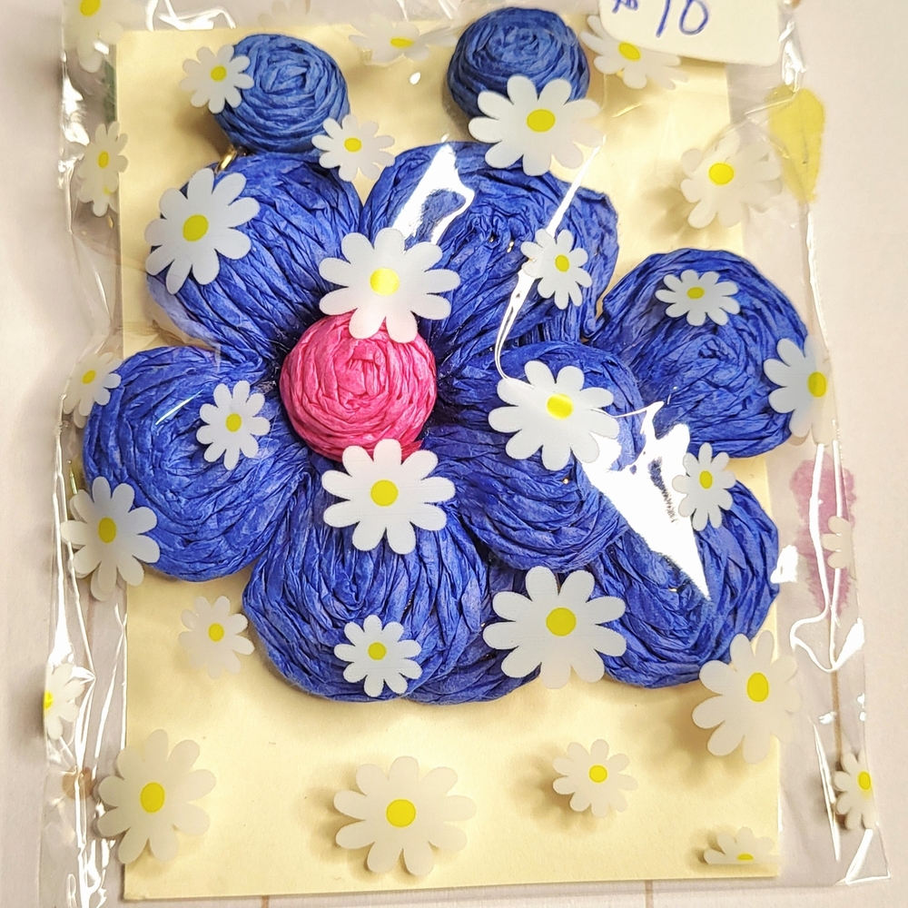 Large blue daisy earrings with pink bud.